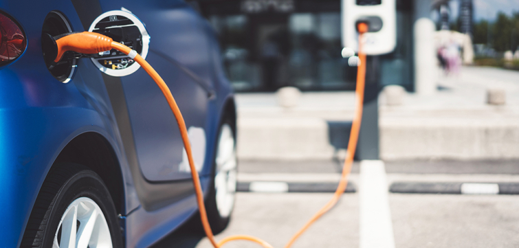 electric car plugged in to charge