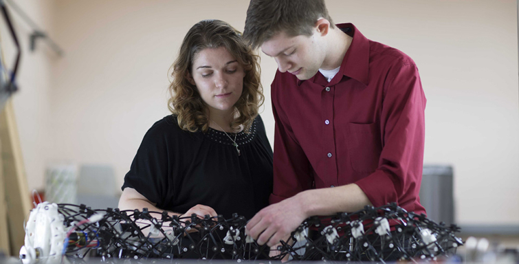 mechanical engineering students working on worm robot